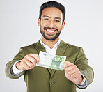 Happy asian man, portrait and money in finance, savings or investment loan against a white studio background. Businessman smile with cash, euro or bill in financial freedom, profit or salary increase