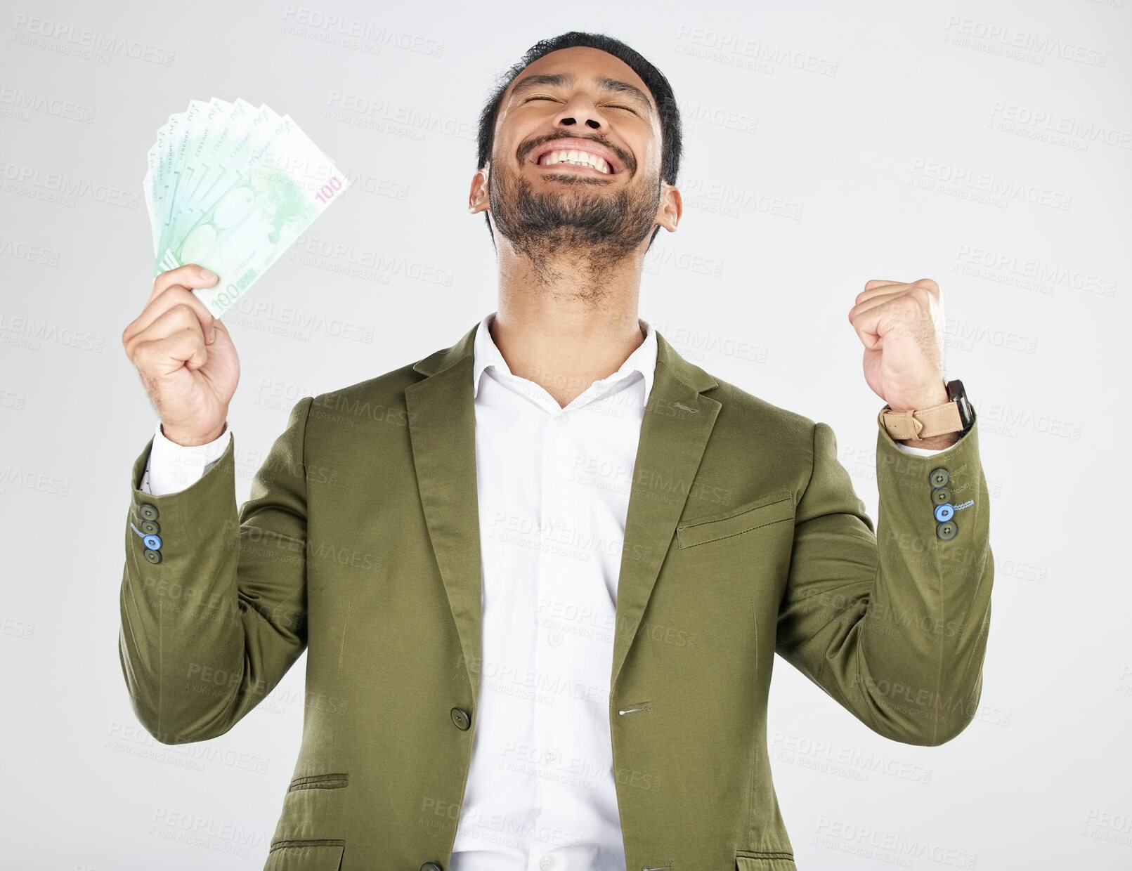 Buy stock photo Money, winner and man with fist celebration in studio for payment, loan or cashback on grey background. Cash, award and Japanese male celebrating investment, growth or financial freedom bingo prize