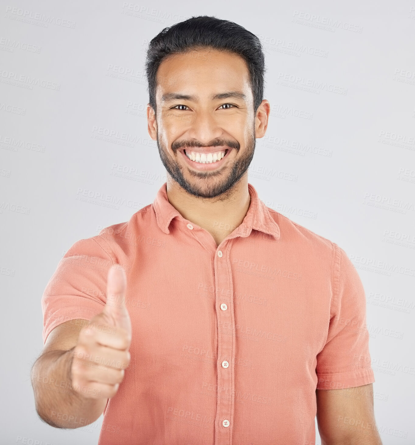 Buy stock photo Happy asian man, portrait and thumbs up in good job, winning or success against a white studio background. Male person smile with like emoji, yes sign or OK in agreement, thank you or approval