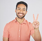Portrait, smile and asian man with peace hands in studio for thank you, support or feedback on grey background. V, emoji and face of happy Japanese guy model with feedback, opinion or positive review