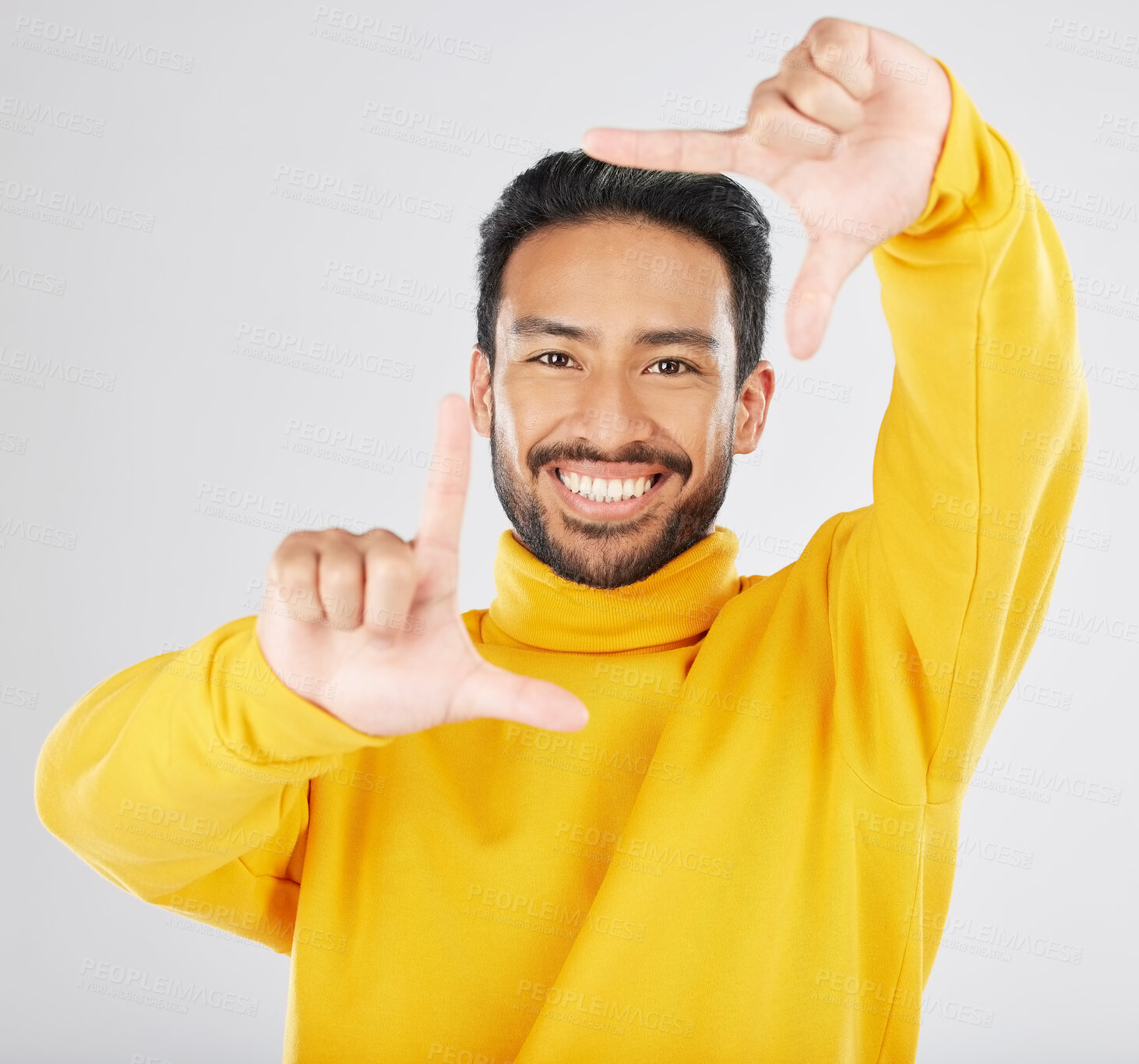 Buy stock photo Finger frame, portrait and man in studio to review profile picture, sign and white background. Happy asian model, hands and border face for planning perspective, photography and creativity of selfie