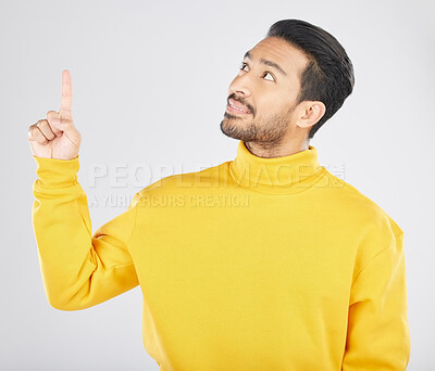 Buy stock photo Announcement, thinking and man pointing for promotion, deal and logo isolated in a studio white background with smile. Choice, offer and happy person or ambassador showing advertising or news