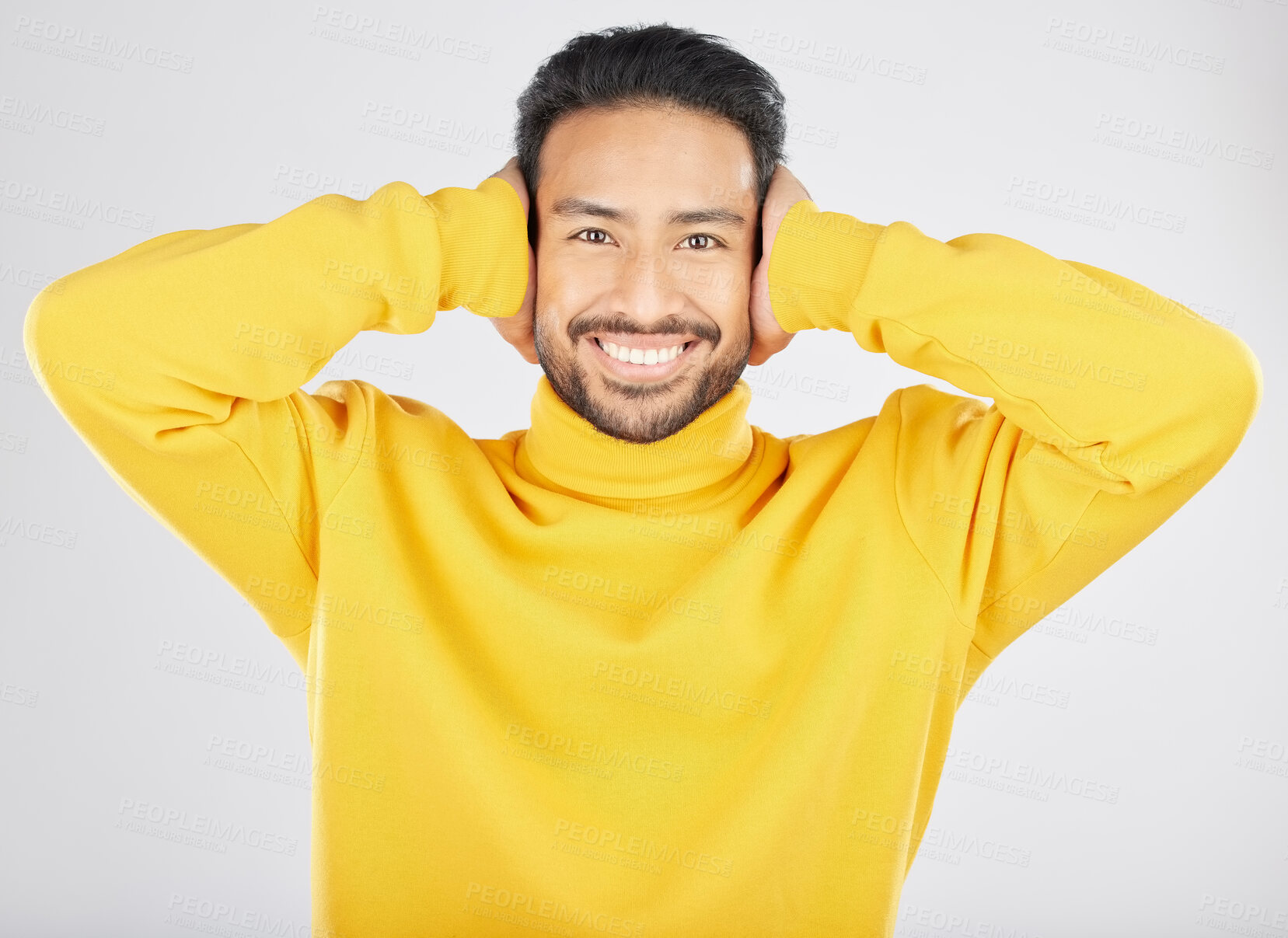 Buy stock photo Portrait, smile and man cover ears in studio isolated on a white background. Face, noise and happy Asian person not listening, hearing loud sound and silence for peace, quiet and ignore to relax.