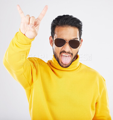 Buy stock photo Man, horns and hand with sunglasses, studio portrait and rock icon for gesture, clothes and white background. Young guy, model and devil fingers for attitude, fashion and sign with emoji for culture