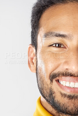 Buy stock photo Half face, smile of man and skincare in studio isolated on a white background mockup space. Portrait, happy and natural beauty of Mexican person in cosmetics, facial treatment or skin health wellness