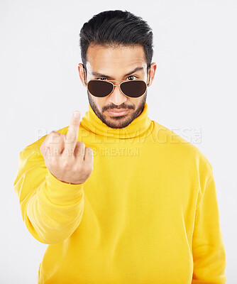 Buy stock photo Man, middle finger and sunglasses in studio portrait with anger, rude and frustrated by white background. Indian fashion model, guy and emoji for sign language, vote or opinion with hand for conflict