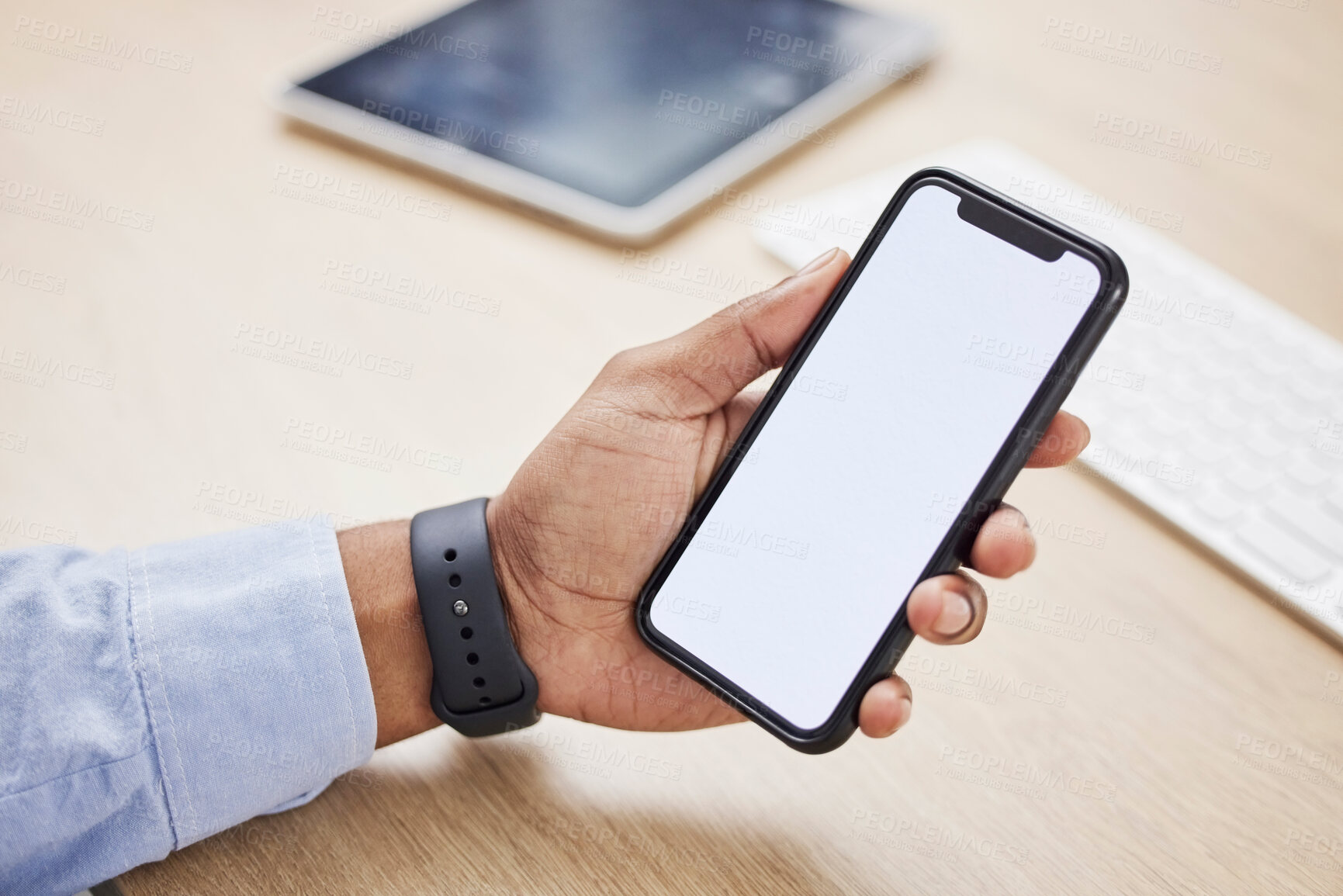 Buy stock photo Closeup, hand and a phone screen for an app at work for business, connection or reading an email. Communication, contact and a businessman with a mobile for blank or mockup technology at a desk