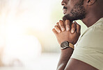 Prayer, worship and hands of black man for worship, faith and belief for support, help and hope. Religion, praying and closeup of person in home for meditation, spiritual healing and trust for praise