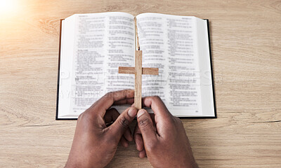 Buy stock photo Bible, reading and cross with hands with book and religion study at home for worship and spiritual support. Faith, christian knowledge and person with gratitude, scripture education or above guidance