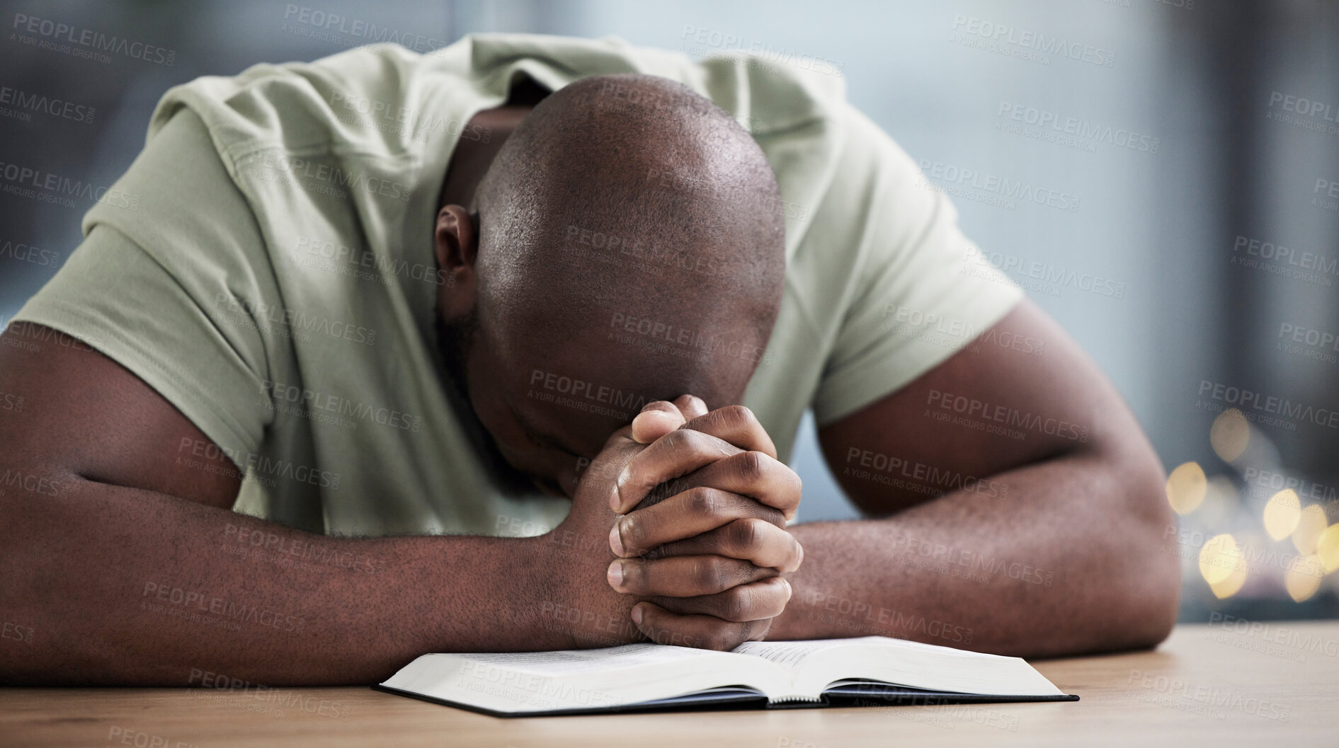 Buy stock photo Bible, praying and man with book and religion study at home for worship and spiritual support. Faith, christian knowledge and person with gratitude, scripture education and hope for guidance in house