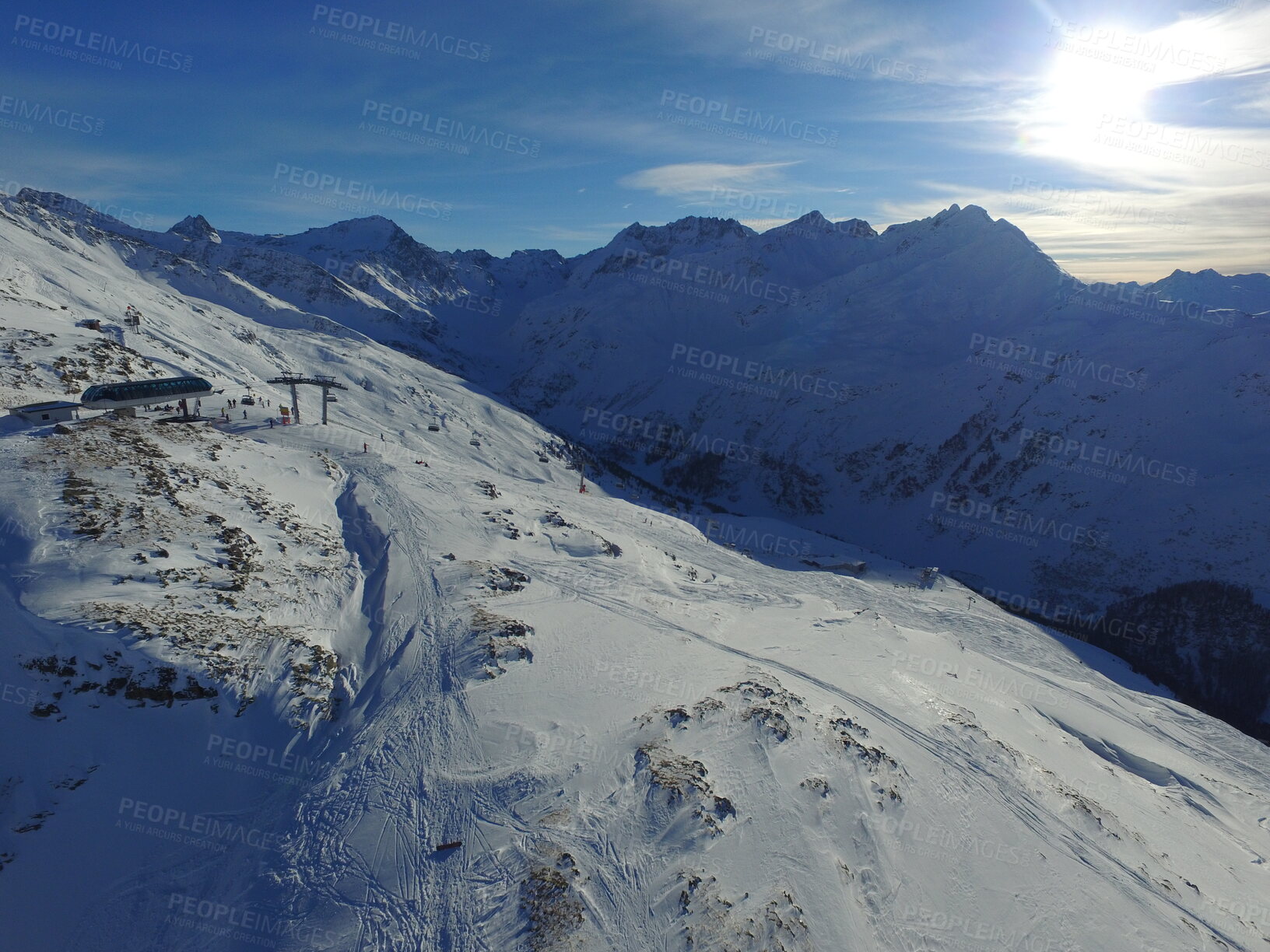 Buy stock photo Morning, sunshine and mountains with snow in the winter for travel, climbing and hiking. Landscape, nature and the view of a natural environment with a blue sky in the Alps for adventure on rocks