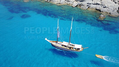 Buy stock photo Boat, sailing in blue water and summer sun on ocean holiday, relax in freedom and nature. Yacht vacation, aerial of travel and tropical cruise on adventure to Greek island with sunshine, fun and sea.