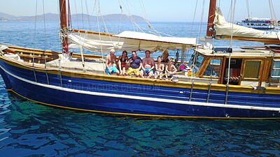 Buy stock photo Group of people on boat, sailing in Greece and summer sun on ocean holiday, relax in freedom and nature. Yacht vacation, family travel and tropical cruise on sea adventure to Greek island on blue sky