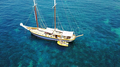 People on yacht, aerial sailing in Greece and summer sun on ocean holiday, relax in freedom and nature. Boat vacation, family travel and tropical cruise on sea adventure to Greek island on blue water