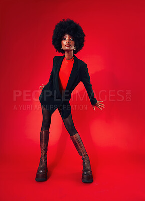 Buy stock photo Black woman, afro and hair with fashion and shine, edgy with designer clothes and gen z isolated on red background. Mockup space, stylish clothing and trendy African model with hairstyle in a studio