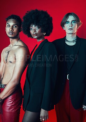 Buy stock photo Fashion, portrait and a group of people on a red background for art, punk and creative aesthetic. Retro, rock and a black woman with men on a studio backdrop for vintage clothes and trendy style