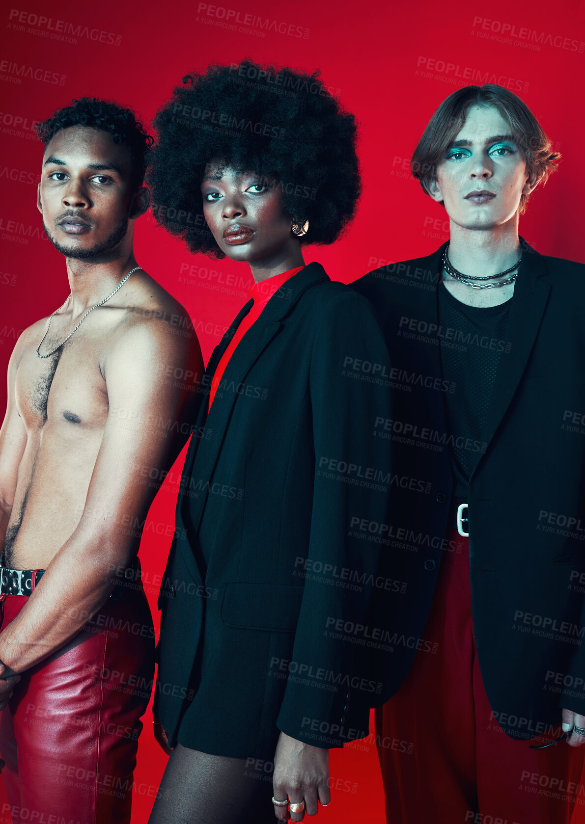 Buy stock photo Fashion, portrait and a group of people on a red background for art, punk and creative aesthetic. Retro, rock and a black woman with men on a studio backdrop for vintage clothes and trendy style