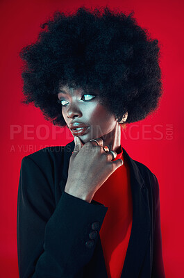 Buy stock photo Black woman, confidence and afro, hair and beauty with shine isolated on red background. Hairstyle, haircare and texture with growth, makeup with skin glow and African fashion model in a studio