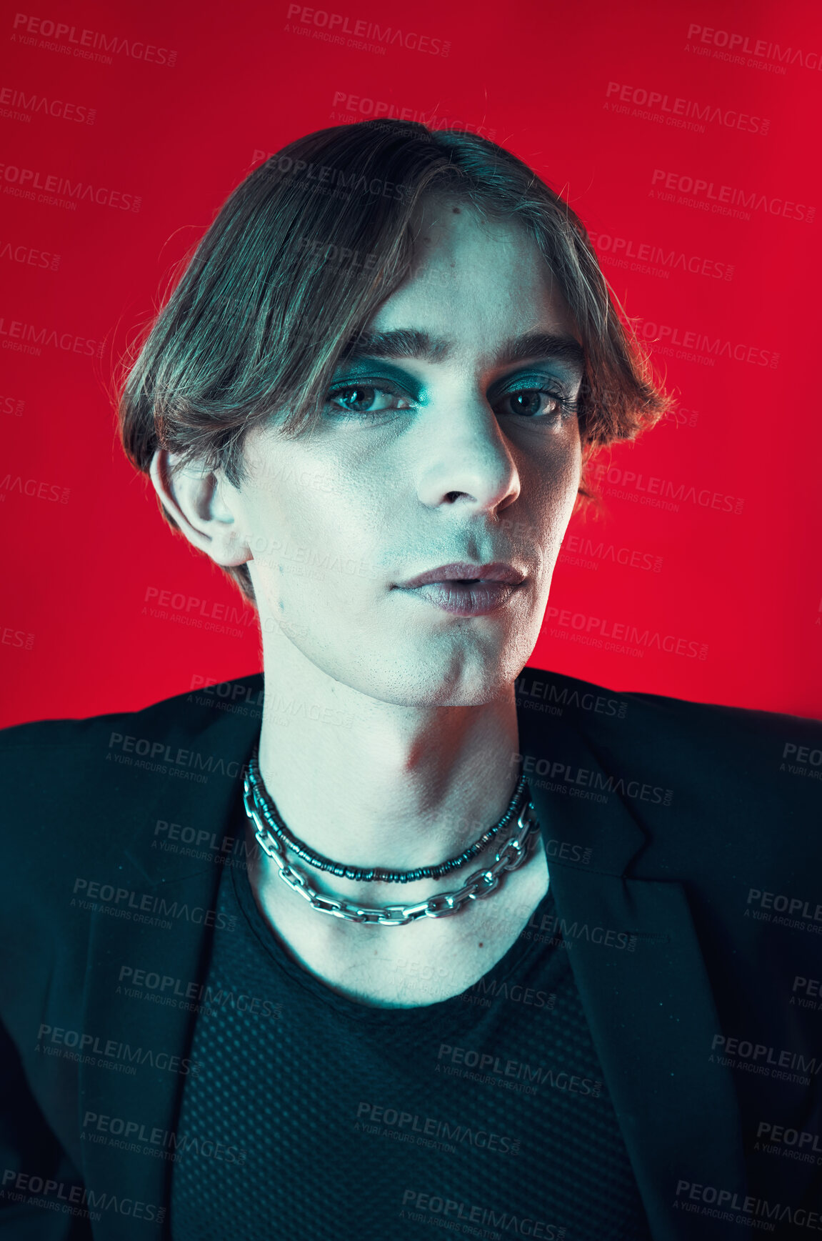 Buy stock photo Fashion, portrait and gay man in makeup at studio isolated on a red background. Cosmetics, lgbtq style and face of model in cool clothes, punk aesthetic and serious person in Australia.