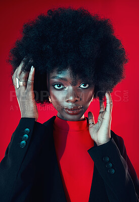 Buy stock photo Black woman, makeup and afro, hair and beauty in portrait with shine isolated on red background. Hairstyle, haircare and texture with growth, skin glow on face and confident African model in a studio