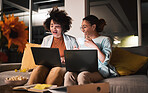 Women, laugh and laptop at night for teamwork, collaboration and working late in office. Communication, deadline and african entrepreneur people talking, planning and brainstorming ideas on a sofa