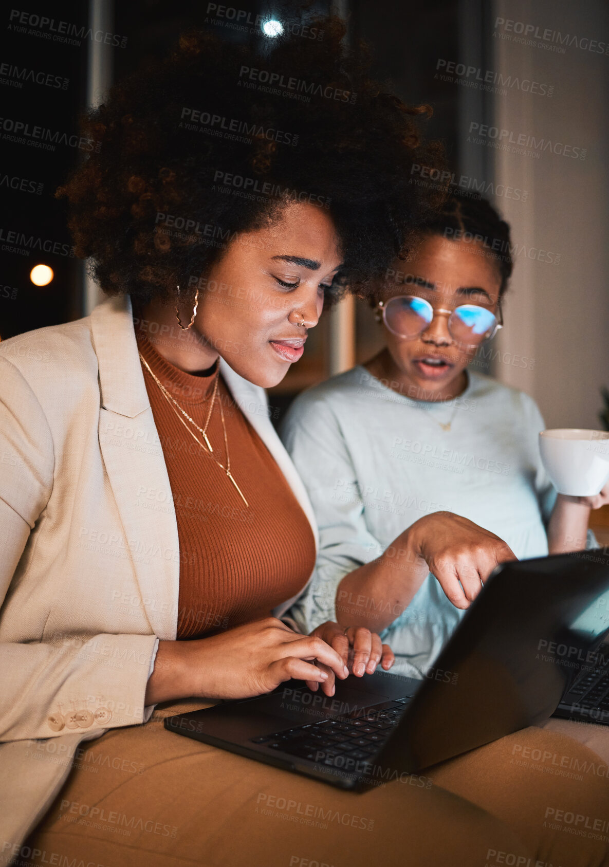 Buy stock photo Women, talking and laptop at night for teamwork, collaboration and working late in office. Communication, deadline and african entrepreneur people planning and typing ideas, search or report online