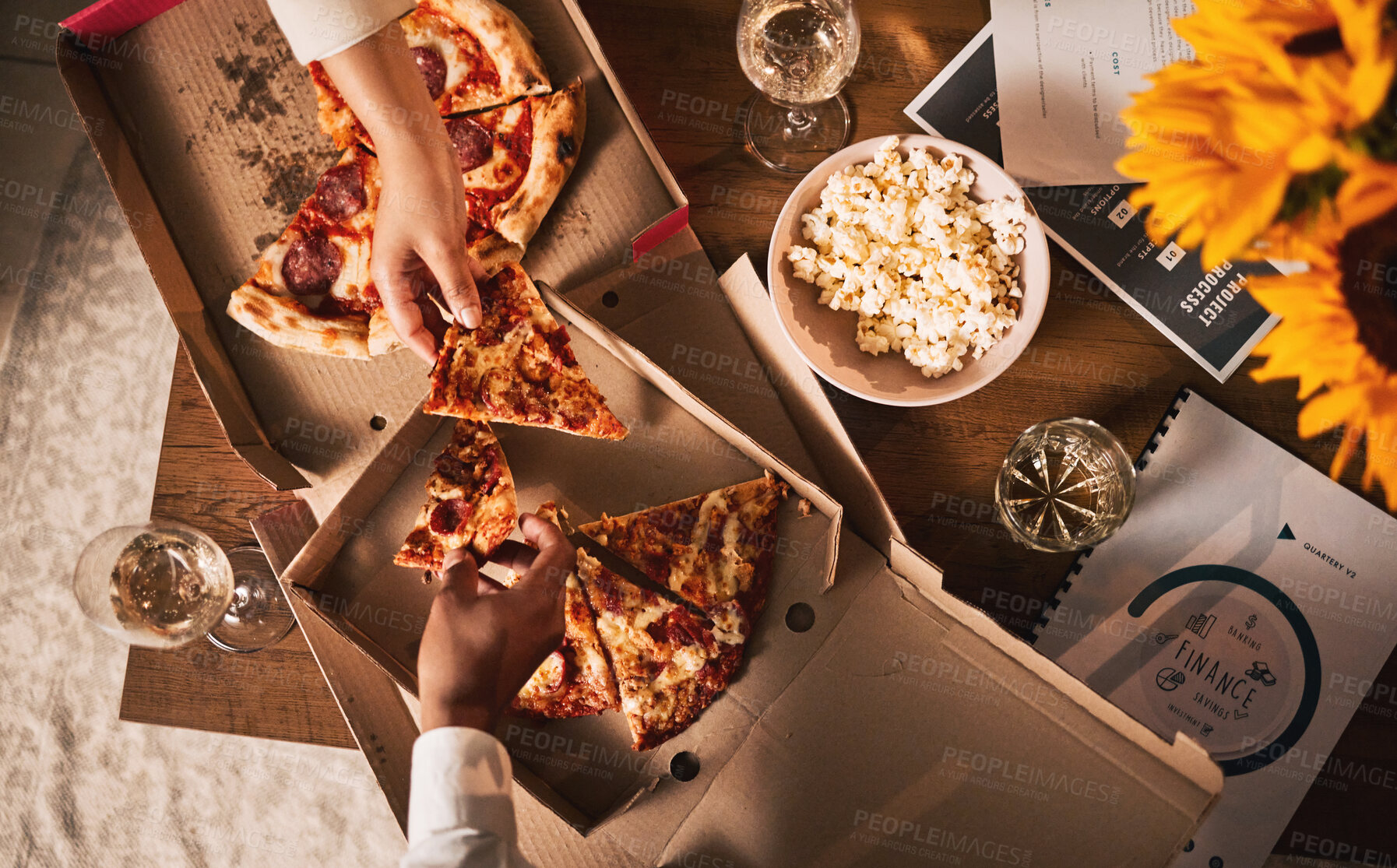 Buy stock photo Food, pizza and hands, business meeting and wine with paperwork, people in team and dinner with top view. Popcorn, Italian cuisine meal and snack, eating and documents, collaboration and working