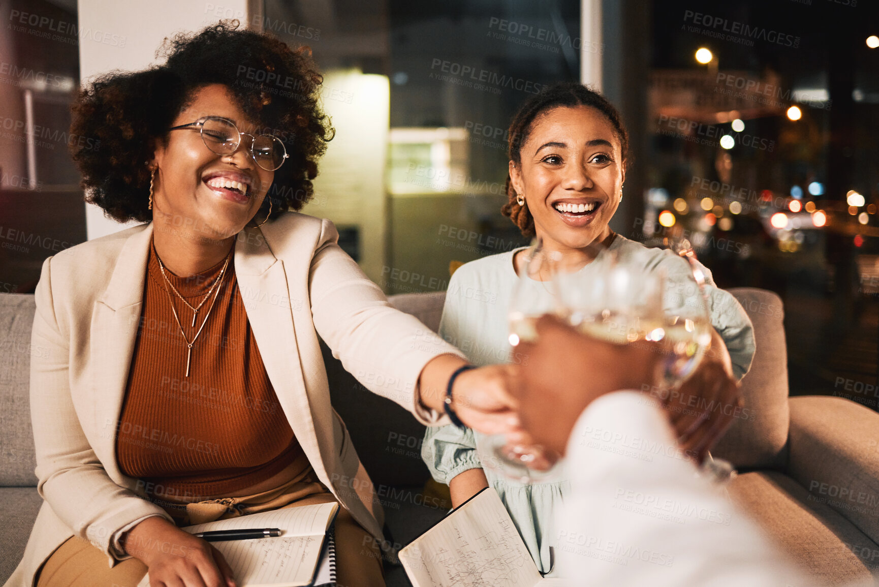 Buy stock photo Black women, business people and night, wine and toast with celebration, deadline target or goals with happiness. Alcohol drink, party and winning, cheers and overtime with working late and meeting