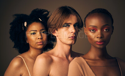 Buy stock photo Diversity, pride and portrait of people with beauty from queer or lgbtq community isolated in a studio brown background. Serious, man and women with creative makeup for equality and inclusion