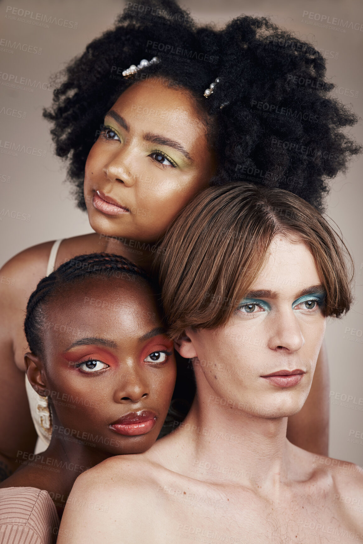 Buy stock photo Cosmetic, beauty and young people in studio with creativity, makeup and facial art aesthetic. Lgbtq, diversity and creative man and women models with face cosmetology isolated by a brown background.