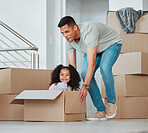 Father, playing and girl in box on floor in living room for celebration, freedom and happiness of new home. Happy, dad and child excited and having fun with property, investment and real estate