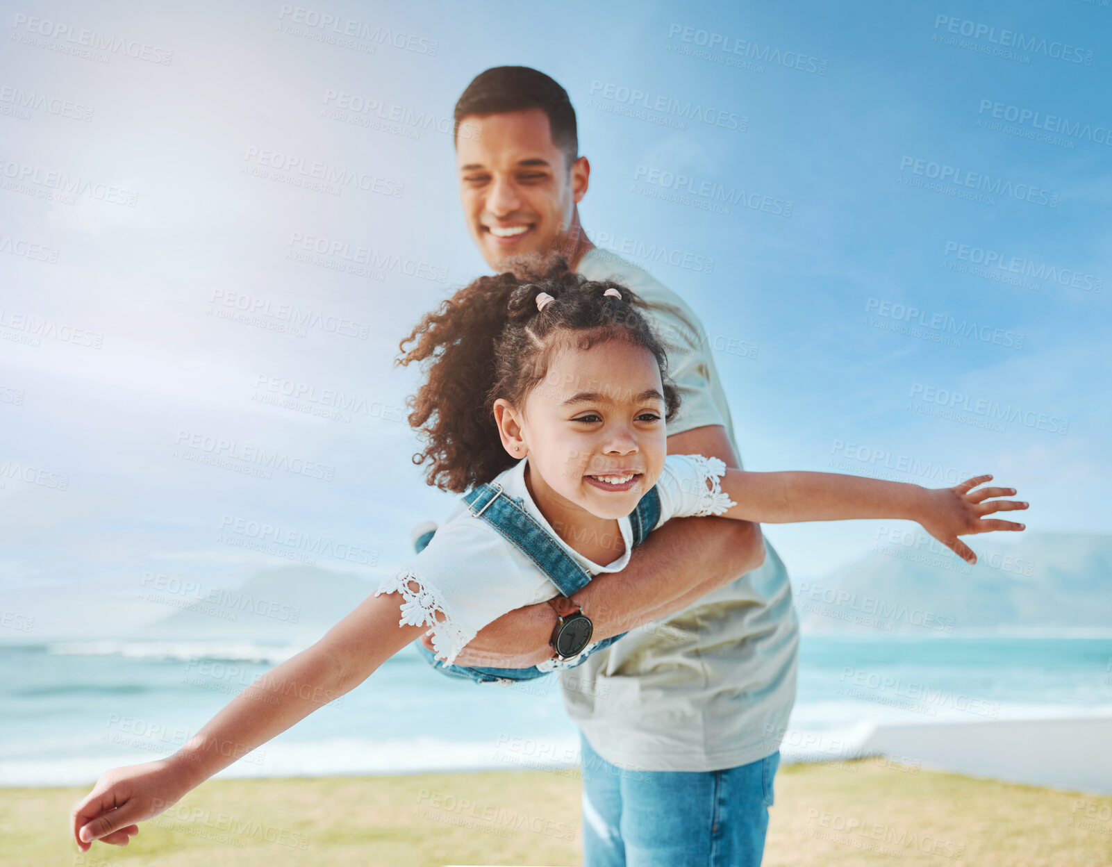 Buy stock photo Dad, playing and girl as a plane on beach for fun game on vacation, holiday or freedom to travel to the ocean in Miami. Child, flying and dad with kid to support, play and bonding together in summer