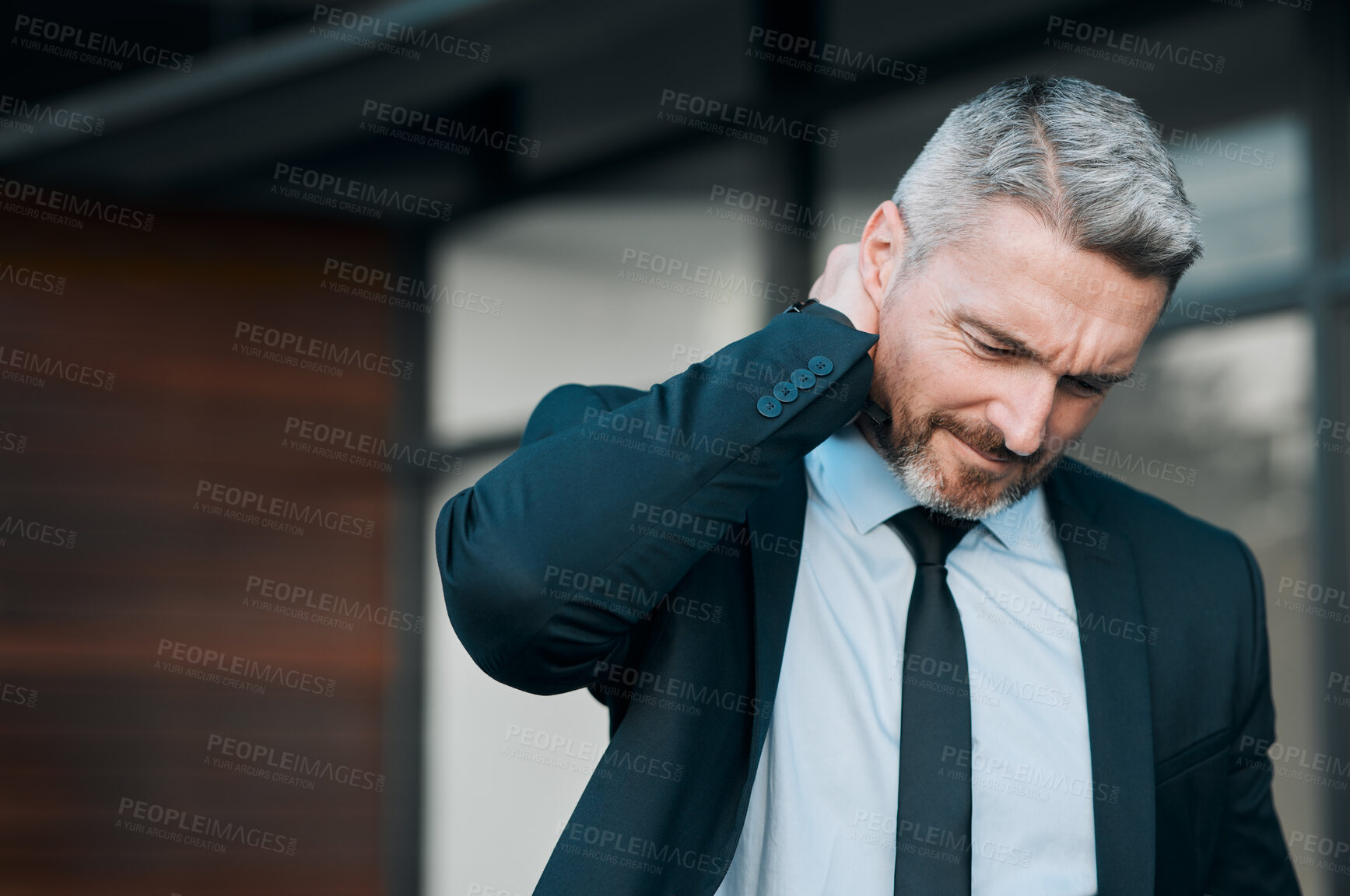 Buy stock photo Tired, mature and a businessman with neck pain in the city from work stress, problem or accident. Sad, medical emergency and a ceo or manager with a muscle injury, frustrated or professional fatigue