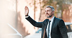 Businessman, wave hand and travel outdoor on city street for professional commute and transport. Mature entrepreneur person with gesture to stop taxi, cab or ride hailing service on urban road