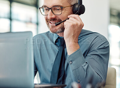 Buy stock photo Senior, happy man and call center on laptop with headphones in customer service or telemarketing at office. Mature businessman, consultant or agent smile in online advice, help or contact us at desk