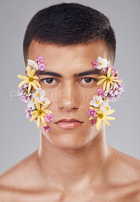 Buy stock photo Portrait, studio or man with flowers for beauty, natural cosmetics or wellness on white background. Nature aesthetic, face or creative model at eco friendly skincare or spring floral art for wellness