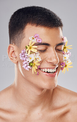 Buy stock photo Cosmetics, man and eyes closed, flower pattern on face and skincare in studio for aesthetic, decoration and beauty on gray background. Smile, closeup and person with floral art for carnation and glow