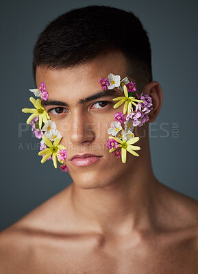 Buy stock photo Portrait, man and flowers, beauty and natural, cosmetics and headshot with art deco isolated on studio background. Nature aesthetic, face and dermatology, eco friendly skincare and clean with spring