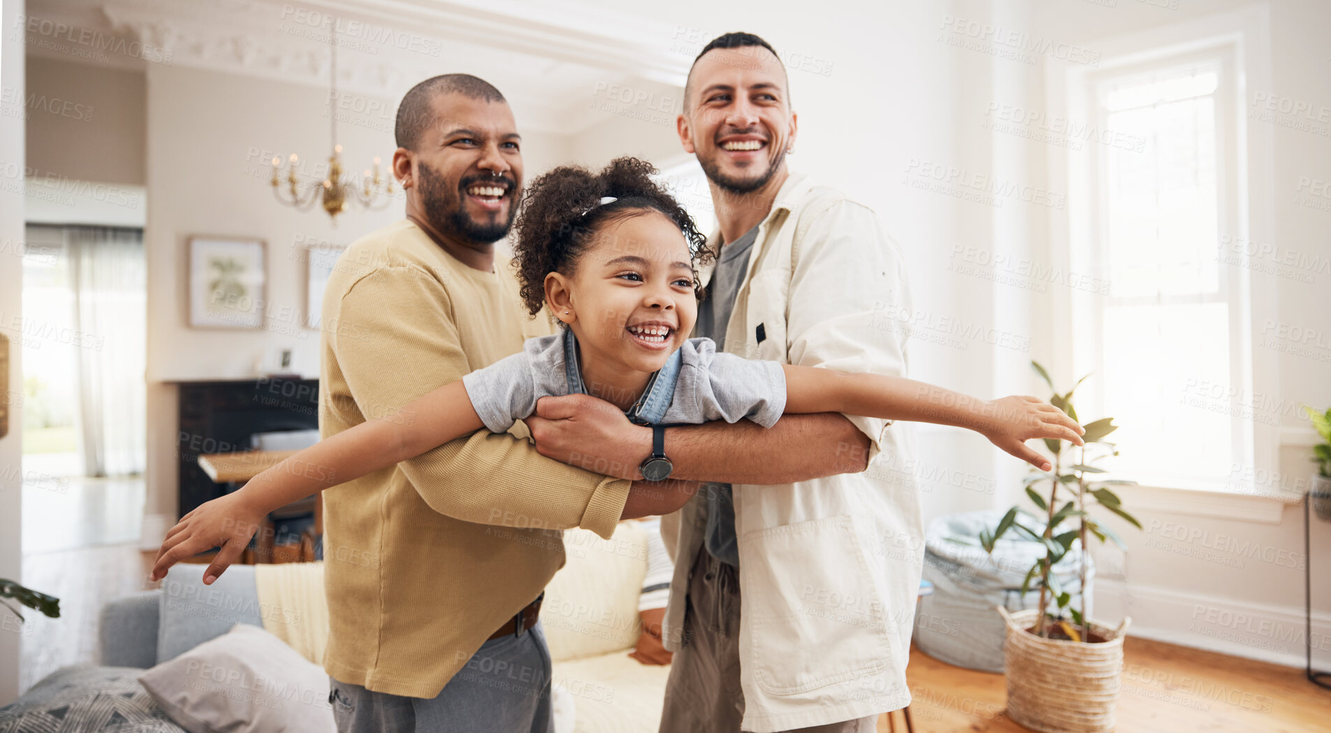 Buy stock photo Gay parents, girl and playing as airplane in home or holding kid as a plane, lifting or flying in living room for fun bonding game. LGBT, father and dad support child together in the air or lounge