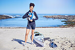 Portrait, kayak and woman with a smile, beach and fitness with training, health and wellness. Person, athlete and girl with water sports, exercise or seaside for kayaking with a vest, trip and travel