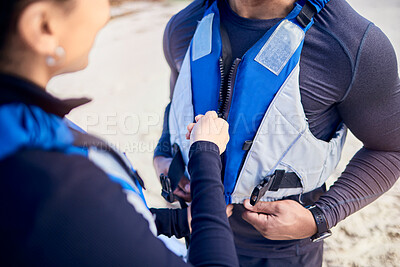 Buy stock photo People, life jackets and helping with safety, vest for water and journey, adventure on river or protection on lake together. Lifejacket, man and woman prepare with instructor or training in sports