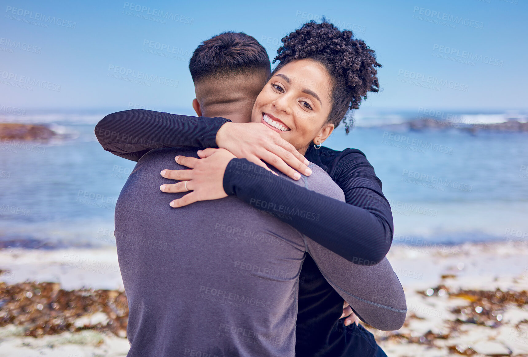 Buy stock photo Fitness, portrait and couple hug at a beach for sports, training and morning cardio in nature. Face, smile and happy woman embrace man at the ocean for running, workout or wellness exercise with love