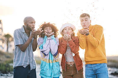 Buy stock photo Friends, outdoor and people blowing confetti outdoor for celebration, motivation and fun. Diversity, happiness and group of men and women for adventure, party and happy youth with freedom in nature
