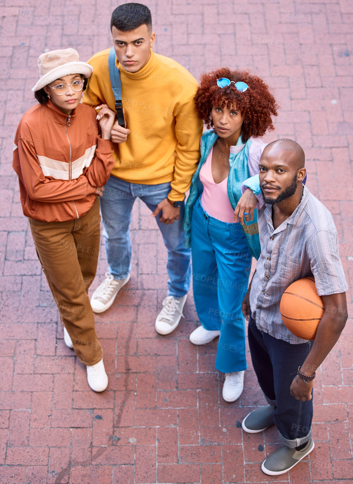 Buy stock photo Friends, city and portrait with basketball outdoor for sport, cool fashion and serious pose. Diversity, gen z and student group of men and woman for adventure and youth on urban street from above
