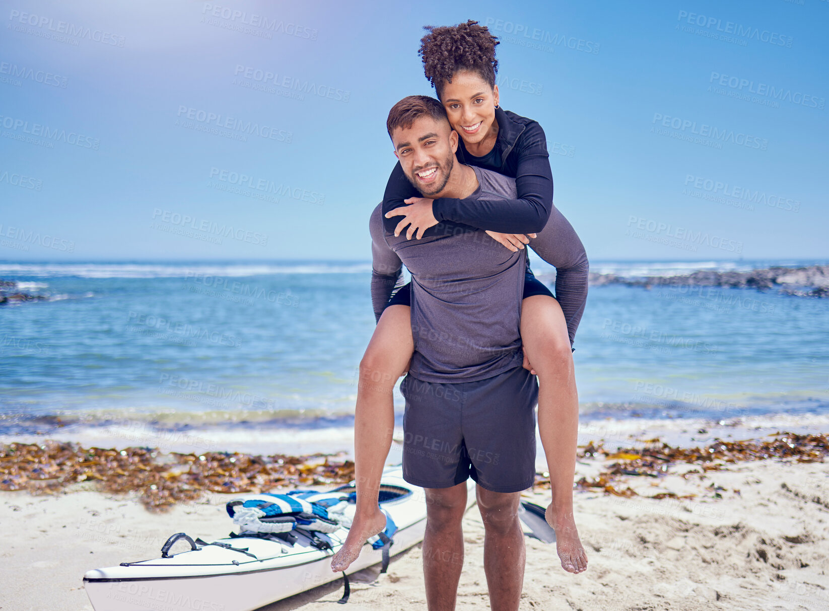 Buy stock photo Sports, fitness and kayak couple piggyback at a beach for training, bond and workout in nature together. Kayaking, portrait and man carrying woman at sea for rowing adventure, workout or fun hobby