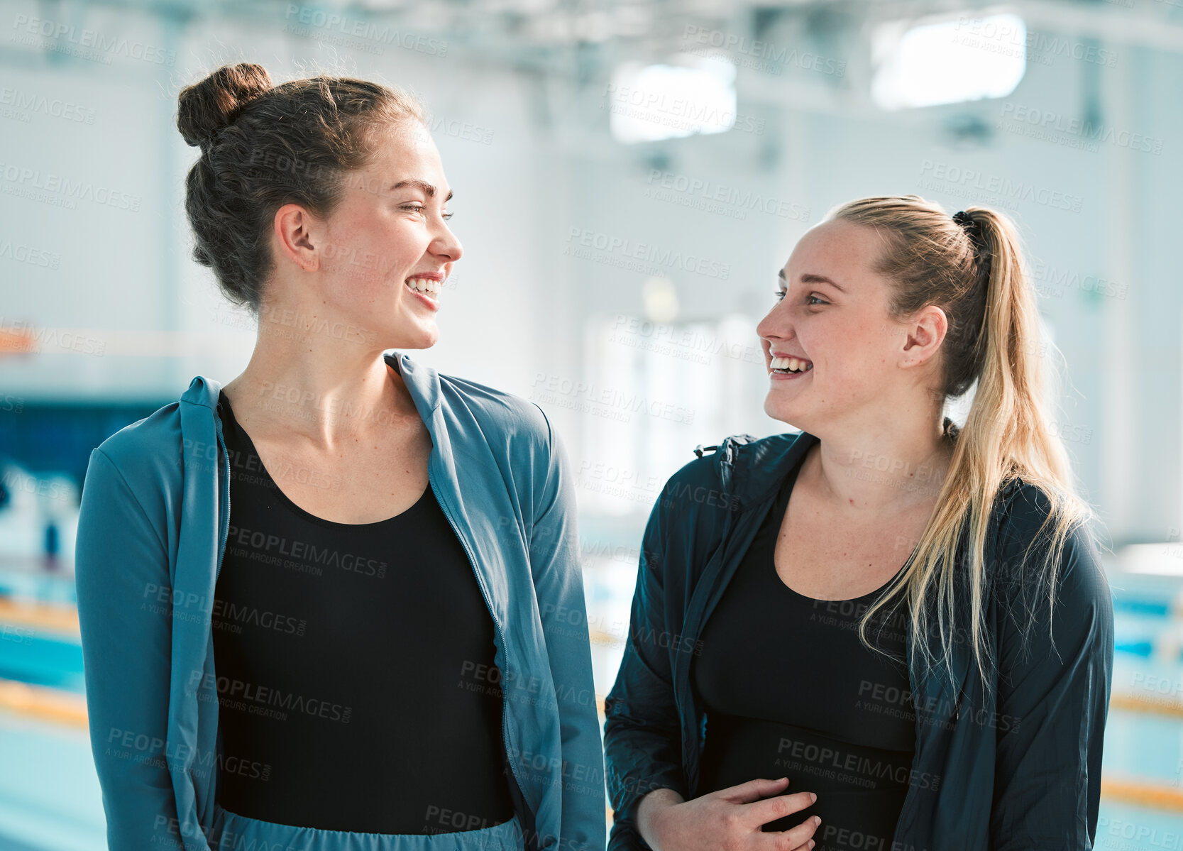 Buy stock photo Fitness, sports and woman swimmer friends by a pool in the gym together for health, training or exercise. Teamwork, wellness and smile with happy young female athletes at an indoor swimming center