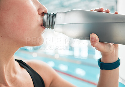 Swimmer, bottle or woman drinking water to relax on break after exercise, workout or fitness training. Hydrate, closeup or sports girl athlete with liquid for wellness or health by swimming pool