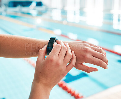 Stopwatch, person or hands of swimmer at swimming pool for sports, workout or fitness progress. Personal trainer, exercise or closeup of athlete with timer to check or monitor clock goal or heartbeat