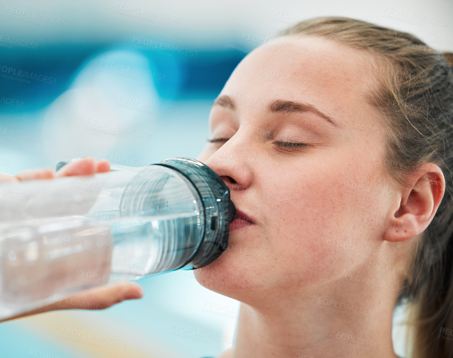 Buy stock photo Swimmer woman, drinking water bottle or thinking for fitness, health or wellness for sport career. Athlete girl, hydration and vision by swimming pool at training, exercise or workout for performance