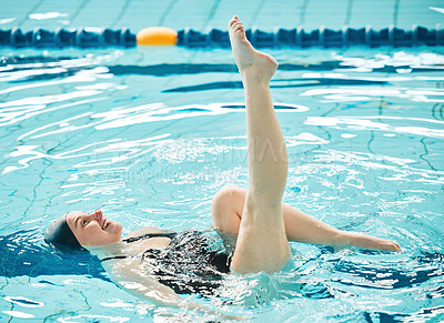 Swimming, woman and legs in ballet exercise, training and healthy body wellness in water. Pool, feet and happy athlete in synchronized workout, sport art or dance performance for fitness in summer.